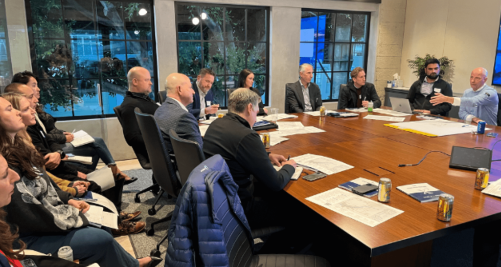 Revenue leaders sitting around a conference table.